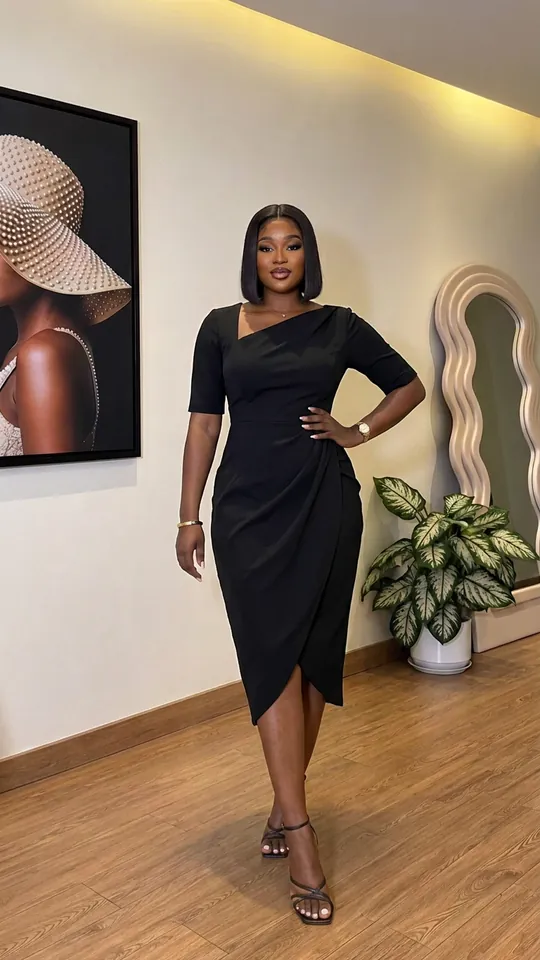Wrap dress in black, worn